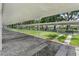 Covered shuffleboard courts, offering a shaded area for outdoor recreation, creating a comfortable playing environment at 305 Siena Vista Pl, Sun City Center, FL 33573