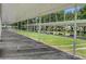 Covered shuffleboard courts, perfect for recreation and friendly competition, offering a shaded area for players at 305 Siena Vista Pl, Sun City Center, FL 33573