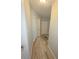 Bright hallway with wood floors and neutral walls at 3727 Dover Dr, Sarasota, FL 34235