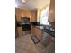 Modern kitchen featuring stainless steel appliances, granite countertops, and ample cabinet space at 3727 Dover Dr, Sarasota, FL 34235