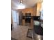 Updated kitchen with stainless steel appliances, tile floors, and ample cabinet space at 3727 Dover Dr, Sarasota, FL 34235