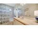 Bathroom with shower, toilet and sink with modern fixtures and finishes at 4198 Vallarta Ct # 3027, Sarasota, FL 34233