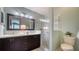 Modern bathroom with double vanity, glass shower, and contemporary fixtures at 4198 Vallarta Ct # 3027, Sarasota, FL 34233
