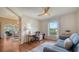 Bright bedroom featuring a ceiling fan, a desk, and a view of the outdoors at 4198 Vallarta Ct # 3027, Sarasota, FL 34233