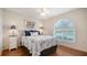 Inviting bedroom features a large window, wood floors, and calming decor at 4198 Vallarta Ct # 3027, Sarasota, FL 34233