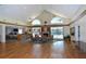 Clubhouse interior with fireplace, bookshelves, and comfortable seating at 4198 Vallarta Ct # 3027, Sarasota, FL 34233