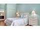 Spacious bedroom with coastal decor, hardwood floors, and a serene, light-filled atmosphere at 4198 Vallarta Ct # 3027, Sarasota, FL 34233