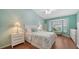 Calming main bedroom with large windows, hardwood floors, and stylish furnishings at 4198 Vallarta Ct # 3027, Sarasota, FL 34233