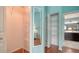 Well-organized walk-in closet with wire shelving and full length mirror at 4198 Vallarta Ct # 3027, Sarasota, FL 34233