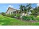 Well-maintained yard with lush landscaping, including flowering bushes and mature trees at 4198 Vallarta Ct # 3027, Sarasota, FL 34233