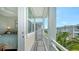 View from a balcony with outdoor seating and neighborhood views, adjoining the main bedroom at 4322 Marina View Way, Cortez, FL 34215