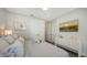 Comfortable bedroom with a TV, decor, a dresser, and a bed with decorative pillows at 4322 Marina View Way, Cortez, FL 34215