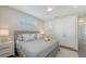 Serene bedroom with a ceiling fan, a soft bed, and a closet behind double doors at 4322 Marina View Way, Cortez, FL 34215
