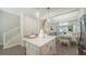 Kitchen island with seating and view to open living room, showing spacious layout at 4322 Marina View Way, Cortez, FL 34215