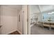 Bright and airy living space with dining area as seen from interior elevator at 4322 Marina View Way, Cortez, FL 34215