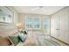 Bright and airy main bedroom with large windows, ceiling fan, and neutral decor at 4322 Marina View Way, Cortez, FL 34215