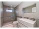 Clean bathroom with tile floor, glass enclosed shower, and modern fixtures at 4353 Indian Point Trl, Sarasota, FL 34238