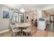 Open dining area adjacent to the kitchen and living room, featuring a decorative table and chairs at 4353 Indian Point Trl, Sarasota, FL 34238