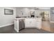 Bright kitchen with stainless steel appliances, granite countertops and tiled floor at 4353 Indian Point Trl, Sarasota, FL 34238