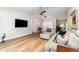 Spacious living room with hardwood floors, comfortable seating, and an open layout, perfect for entertaining at 4353 Indian Point Trl, Sarasota, FL 34238
