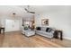 Cozy living room featuring hardwood floors, comfortable seating, and an open layout, perfect for entertaining at 4353 Indian Point Trl, Sarasota, FL 34238
