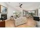 Open concept living area with vaulted ceiling, fireplace and access to kitchen at 4353 Indian Point Trl, Sarasota, FL 34238