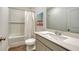 Clean bathroom featuring a shower/tub combination, white cabinets, a bright countertop, and wood-look flooring at 4425 Boxelder Avenue, Parrish, FL 34219
