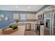 Stylish kitchen featuring stainless steel appliances, ample cabinet space, and a breakfast bar area at 4425 Boxelder Avenue, Parrish, FL 34219