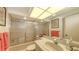 A well lit bathroom showcasing a sink, vanity, shower and ample storage at 4511 Windsor Park, Sarasota, FL 34235