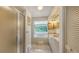 A naturally lit bathroom featuring a glass shower, soaking tub, and built-in vanity at 4511 Windsor Park, Sarasota, FL 34235