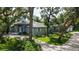 Charming single-story home featuring mature landscaping, a concrete driveway, and a serene setting at 4511 Windsor Park, Sarasota, FL 34235