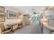 Bright kitchen with white cabinets, table, and access to the outdoors at 4511 Windsor Park, Sarasota, FL 34235