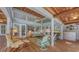 Inviting living room with wood paneled ceilings, comfortable seating and screened windows at 4511 Windsor Park, Sarasota, FL 34235