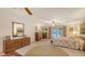 Bright and spacious main bedroom featuring a ceiling fan, dressers and private access to the pool at 4511 Windsor Park, Sarasota, FL 34235