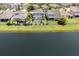 This is an aerial view of a neighborhood that sits on a large pond with fountains at 4617 Garden Arbor Way, Bradenton, FL 34203