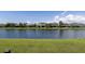 Green grass backyard overlooking a pond at 4617 Garden Arbor Way, Bradenton, FL 34203