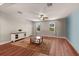 Bedroom showcasing hardwood floors, a modern ceiling fan, and bright windows, creating a comfortable and inviting space at 4617 Garden Arbor Way, Bradenton, FL 34203
