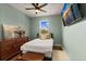 Cozy bedroom with a comfortable bed, scenic view from window, and stylish decor at 4617 Garden Arbor Way, Bradenton, FL 34203