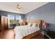 Well-lit bedroom with ample natural light, a comfortable bed, and stylish furnishings at 4617 Garden Arbor Way, Bradenton, FL 34203