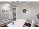 Dining room showcasing light walls, dark hardwood floors, and neutral tones for a modern look at 4617 Garden Arbor Way, Bradenton, FL 34203