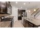 Gourmet kitchen with granite counters, stainless appliances, and tiled backsplash at 4617 Garden Arbor Way, Bradenton, FL 34203