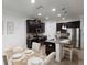 Modern kitchen featuring granite countertops, stainless steel appliances, and dark cabinets at 4617 Garden Arbor Way, Bradenton, FL 34203