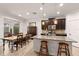Kitchen with granite counters, modern stainless steel appliances, and bar stool seating at 4617 Garden Arbor Way, Bradenton, FL 34203
