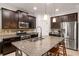 Spacious kitchen featuring stainless steel appliances, granite countertops, and tiled backsplash at 4617 Garden Arbor Way, Bradenton, FL 34203