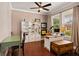 Well-lit office with a large desk, shelving, and two windows overlooking the yard at 4617 Garden Arbor Way, Bradenton, FL 34203