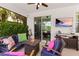 Cozy covered patio with outdoor furniture, fire pit, and entertainment setup at 4617 Garden Arbor Way, Bradenton, FL 34203