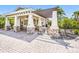 Outdoor pavilion with stone pillars and covered seating, ideal for outdoor dining and entertaining at 4617 Garden Arbor Way, Bradenton, FL 34203