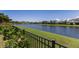 Scenic view of the community pond, surrounded by lush greenery and well-maintained landscaping at 4617 Garden Arbor Way, Bradenton, FL 34203