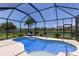 Screened pool area featuring a beautiful pool with view of the pond at 4617 Garden Arbor Way, Bradenton, FL 34203