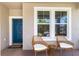 Inviting front porch with seating area, creating a welcoming entrance to the home at 4617 Garden Arbor Way, Bradenton, FL 34203